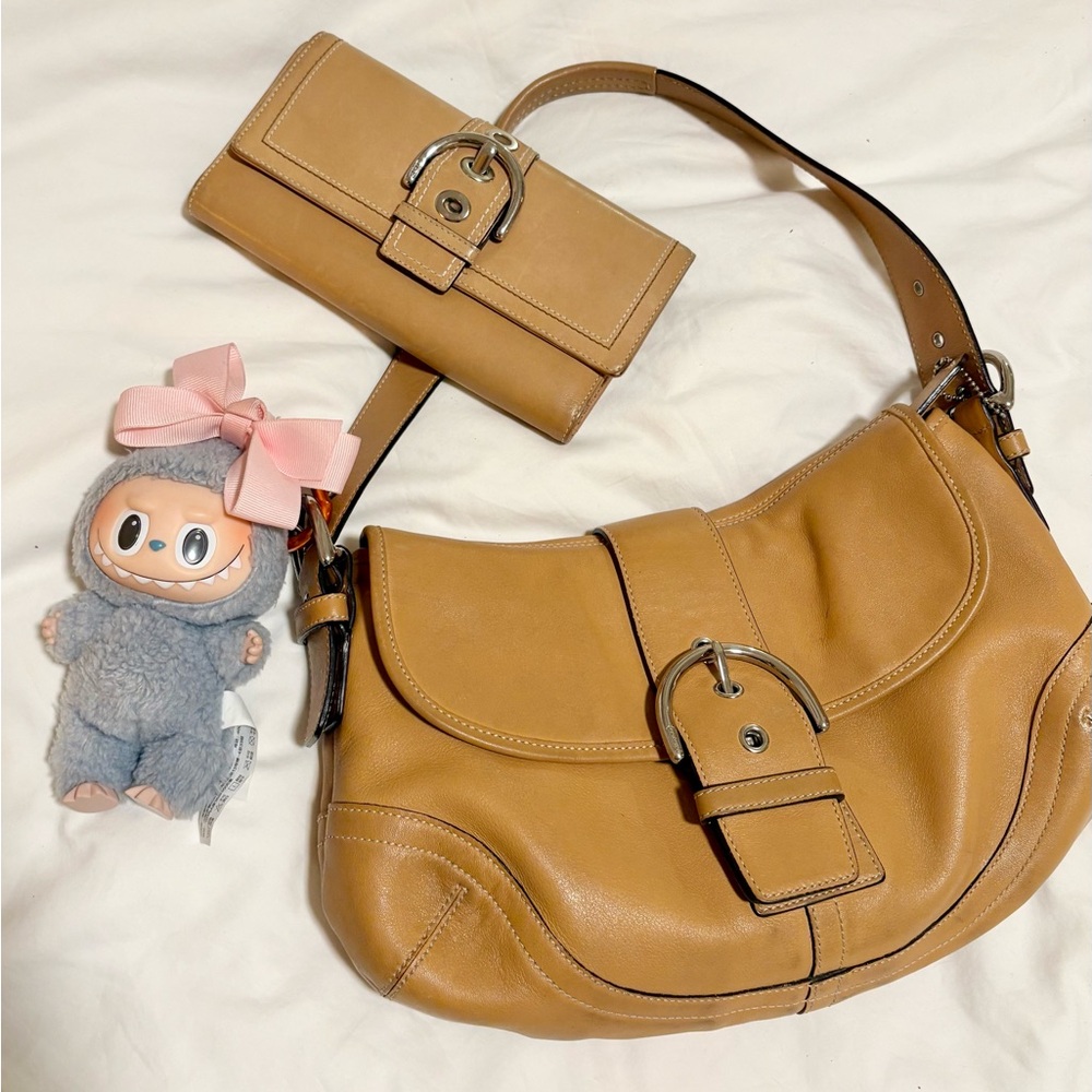 Coach SoHo bag paired with a matching Coach wallet